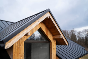Modern residential home with an asphalt shingle roof under clear skies before Florida's storm season.